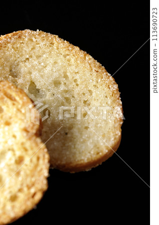 Rusks photographed against a black background Rusks photographed against a black background 113690723