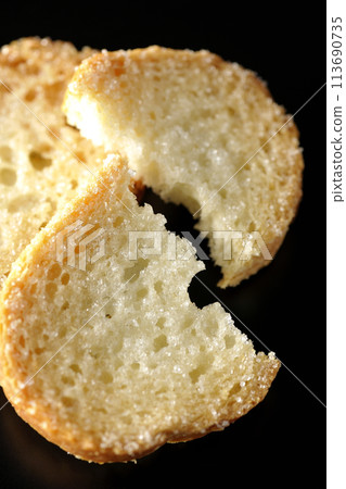 Rusks photographed against a black background Rusks photographed against a black background 113690735