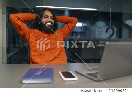 Man relaxed and thinking at desk 113690754