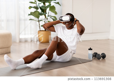 Man in home workout session with equipment Man in home workout session with equipment 113691308