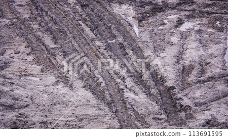 Kiev, Ukraine, October 17, 2018: Workers in the mud of a construction site at the stage of excavation; construction of a supermarket AUCHAN Kiev, Ukraine, October 17, 2018: Workers in the mud of a construction site at the stage of excavation; construction of a supermarket AUCHAN 113691595