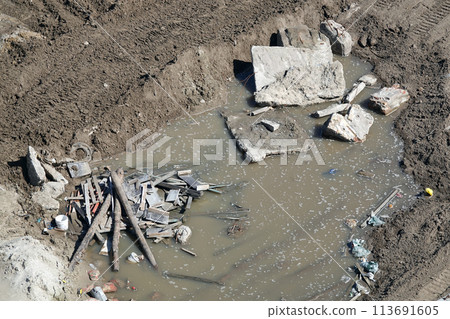 Kiev, Ukraine March 13, 2019: Foundation zero cycle construction, concrete piles at construction site Kiev, Ukraine March 13, 2019: Foundation zero cycle construction, concrete piles at construction site 113691605
