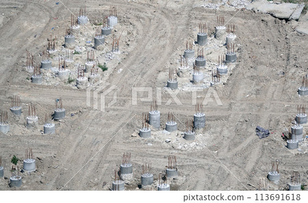 Kiev, Ukraine March 13, 2019: Foundation zero cycle construction, concrete piles at construction site Kiev, Ukraine March 13, 2019: Foundation zero cycle construction, concrete piles at construction site 113691618