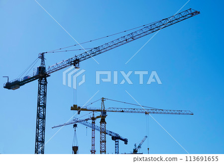 Kiev, Ukraine March 18, 2020: tower construction cranes on the construction of high-rise buildings 113691655