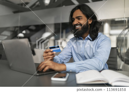 Professional man shopping online with credit card Professional man shopping online with credit card 113691858