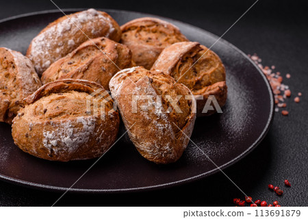 Fresh baked bread buns with salt, spices, seeds and grains 113691879