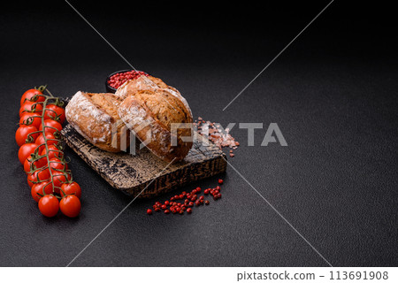 Fresh baked bread buns with salt, spices, seeds and grains 113691908