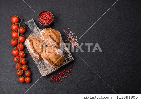 Fresh baked bread buns with salt, spices, seeds and grains 113691909