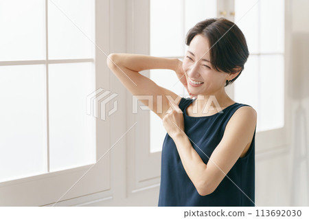 Woman checking her armpits Woman checking her armpits 113692030
