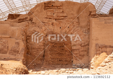 Beautiful stone desert mountain landscape of Israel. Ruins of the old ancient city Dan. Main gate Beautiful stone desert mountain landscape of Israel. Ruins of the old ancient city Dan. Main gate 113692112