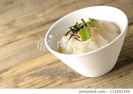 Sea bream chazuke with mitsuba, shredded nori seaweed, and wasabi before adding the dashi broth Sea bream chazuke with mitsuba, shredded nori seaweed, and wasabi before adding the dashi broth 113692349