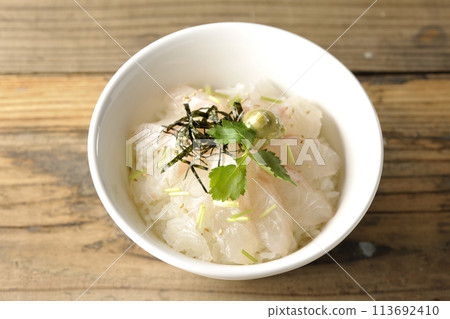 Aerial view of sea bream chazuke with mitsuba, shredded seaweed, and wasabi before the dashi broth is added Aerial view of sea bream chazuke with mitsuba, shredded seaweed, and wasabi before the dashi broth is added 113692410