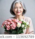 Senior women with flowers 113692789