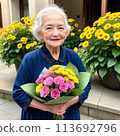 Senior woman holding flowers 2 113692796