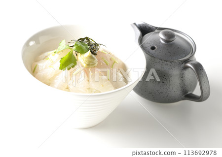 Sea bream chazuke with mitsuba, shredded seaweed, and wasabi before adding dashi and a teapot photographed against a white background Sea bream chazuke with mitsuba, shredded seaweed, and wasabi before adding dashi and a teapot photographed against a white background 113692978