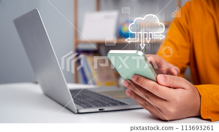 Businesswoman downloading business data from internet network showing usage of big data network and cloud computing system. Businesswoman downloading business data from internet network showing usage of big data network and cloud computing system. 113693261