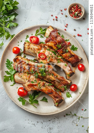 Tender pork ribs glazed with BBQ sauce, garnished with fresh rosemary Tender pork ribs glazed with BBQ sauce, garnished with fresh rosemary 113694681