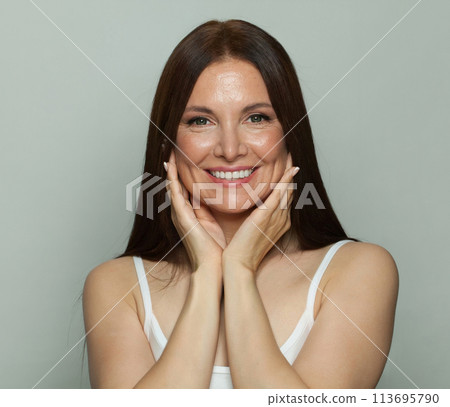 Perfect 50s middle aged mature woman looking at camera, fashion beauty portrait.  113695790