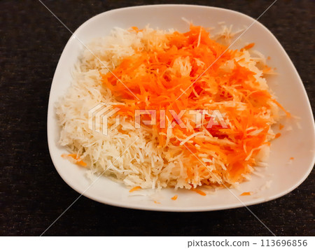 Winter salad of carrots and celery served on a white plate Winter salad of carrots and celery served on a white plate 113696856