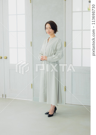 Woman looking out the window 113698730