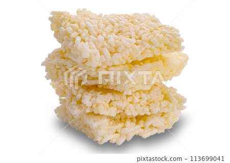 Closeup view stack of crispy homemade rice crackers isolated on white background. Closeup view stack of crispy homemade rice crackers isolated on white background. 113699041