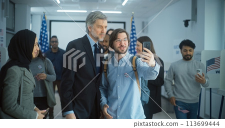 Diverse people take pictures with presidential candidate after voting Diverse people take pictures with presidential candidate after voting 113699444