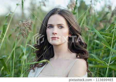 Fashion portrait of healthy young brunette woman with fresh clear skin and long dark brown hair  113699465