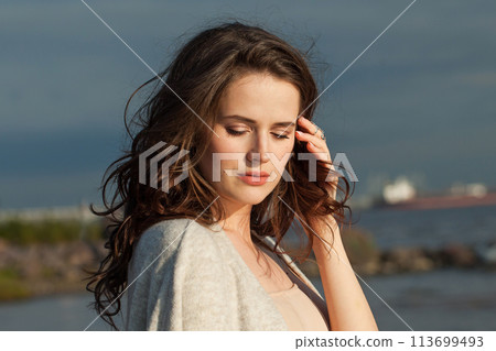 Relaxing young woman model with brown hair and natural make-up Relaxing young woman model with brown hair and natural make-up 113699493