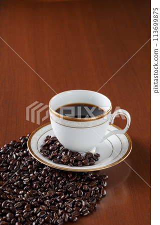 Coffee beans in a cup 113699875