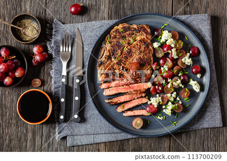 fried beef steak with salad of grape, cheese fried beef steak with salad of grape, cheese 113700209