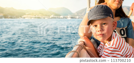 Toddler with mother enjoys boat trip past coast of Marmaris 113700210