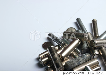 Used finger batteries on a white background. Field for text. Used finger batteries on a white background. Field for text. 113700235
