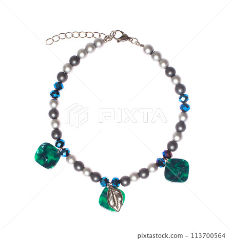 Green and blue jewelry necklace with semiprecious stones, pearl and gold chain isolated 113700564