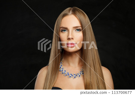 Attractive jewelry model beautiful woman portrait. Brunette woman with long smooth hair and necklace Attractive jewelry model beautiful woman portrait. Brunette woman with long smooth hair and necklace 113700677