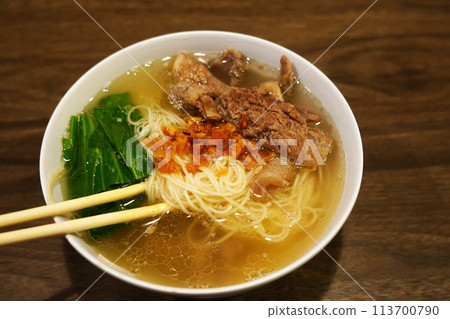 A bowl of misua or wheat vermicelli with beef tendon. A bowl of misua or wheat vermicelli with beef tendon. 113700790