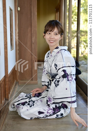 Portrait of a young woman wearing a yukata Portrait of a young woman wearing a yukata 113701115