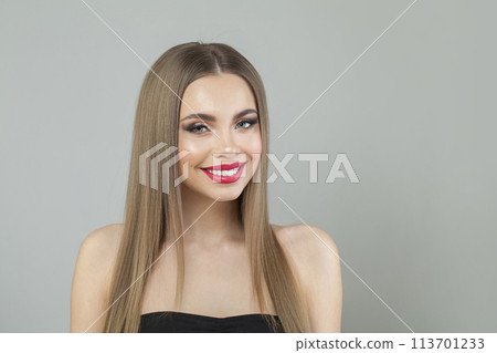 Happy fashion model woman with fresh skin, long black smooth straight hairstyle and makeup posing  113701233