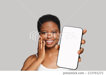 Fresh healthy woman holding smartphone with white empty blank screen display  113701271