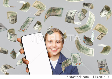 Cute little girl having fun with empty white smartphone display and falling US Dollar money 113701304
