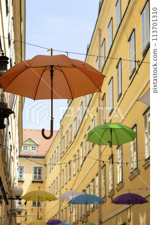 A street in Vienna with suspended umbrellas A street in Vienna with suspended umbrellas 113701310