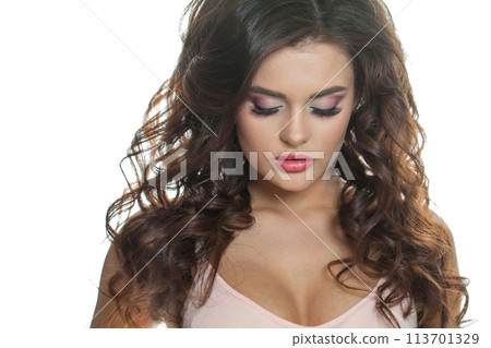 Glamorous female model portrait. Beauty woman with clean skin, brown curly hair and makeup  Glamorous female model portrait. Beauty woman with clean skin, brown curly hair and makeup  113701329