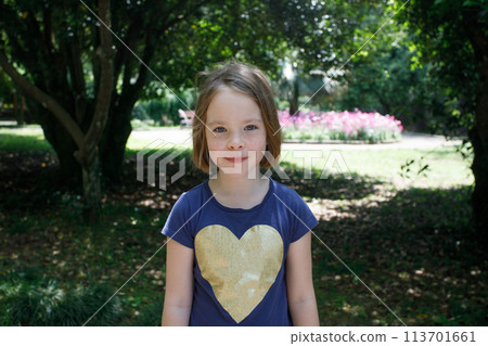 Happy little girl kid outdoors portrait 113701661