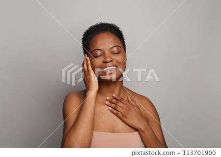 Lovely healthy lady with dark clean fresh skin on white background. Advertising, product placement Lovely healthy lady with dark clean fresh skin on white background. Advertising, product placement 113701900