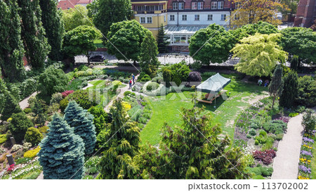 Amazing drone point of view on Wroclaw Botanical garden with flowerbeds and garden pathes Amazing drone point of view on Wroclaw Botanical garden with flowerbeds and garden pathes 113702002