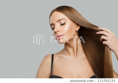 Glorious fashion model woman with long healthy hairstyle, fresh shiny skin and makeup 113702133