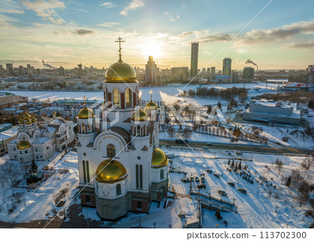 Winter Yekaterinburg and Temple on Blood in beautiful blue clear sunset. Aerial view of Yekaterinburg, Russia. Translation of the text on the temple Winter Yekaterinburg and Temple on Blood in beautiful blue clear sunset. Aerial view of Yekaterinburg, Russia. Translation of the text on the temple 113702300