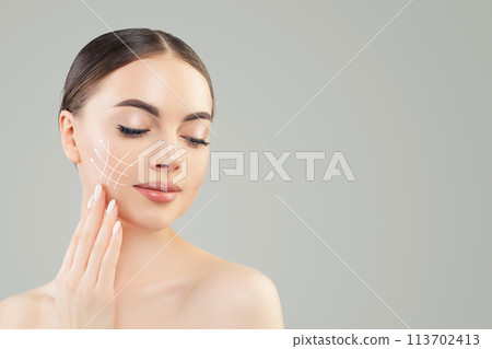 Clean female face with healthy skin and cosmetology lines, medicine and plastic surgery concept 113702413