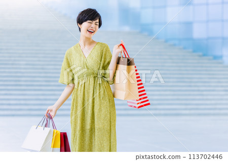 Woman shopping at a shopping center Woman shopping at a shopping center 113702446