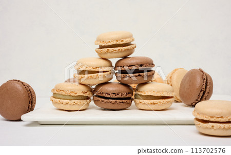 Chocolate macarons on a white background Chocolate macarons on a white background 113702576