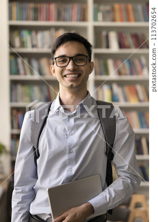 Vertical portrait of smiling Indian student guy Vertical portrait of smiling Indian student guy 113702654
